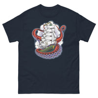 A navy t-shirt with an old-school clipper ship tattoo design in green and brown with white sails surrounded by octopus tentacles in shades of red with purple tentacles. Behind the ship are purple-tinged clouds.
