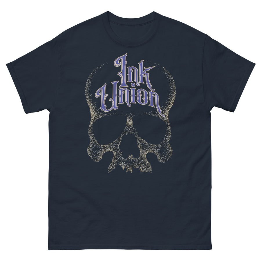 A navy blue t-shirt  adorned with a gold dot work human skull and the words Ink Union in fancy gold and blue lettering across the forehead of the skull.