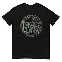 A black t-shirt adorned with the Ink Union Tattoo Co. green and gold with a Silver tattoo machine logo.