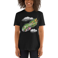 An attractive woman wears a black t-shirt with a military green neo-traditional bomb tattoo design. The bomb is falling with a look of determination in its eyes, an evil toothy grin, and its tongue hanging out of its mouth. Flames are coming from the back of the bomb, and some clouds are in the background.