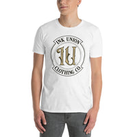 An attractive man is wearing a white t-shirt with the Ink Union Clothing Co Badge logo in black and gold.