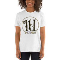 An attractive woman wearing an Ink Union Clothing Co. white t-shirt featuring the Ink Union ring logo in black and gold.