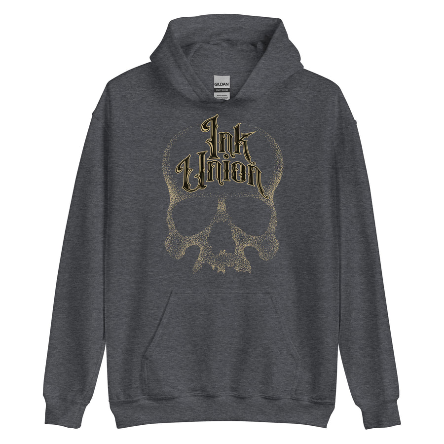 A dark grey hoodie adorned with a gold dot work human skull and the words Ink Union in fancy gold and black lettering across the forehead of the skull.