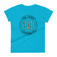 A  light blue t-shirt with the Ink Union Clothing Co Badge logo in black and gold centered on the front of the shirt.