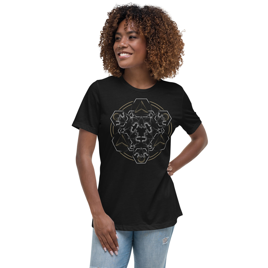 A woman wearing a black t-shirt with a mandala built from white dot work skulls and gold and white geometric shapes.