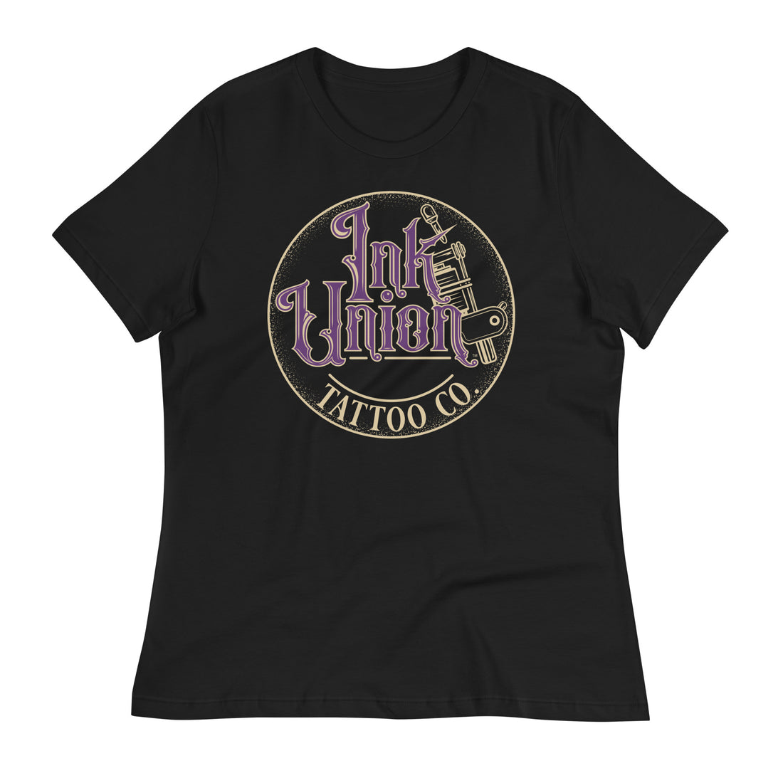 A black t-shirt with a gold circle containing fancy lettering in purple and gold that says Ink Union and a gold tattoo machine peeking out from behind on the right side.  There is a dot work gradient inside the circle, and the words Tattoo Co. in gold are at the bottom of the design.