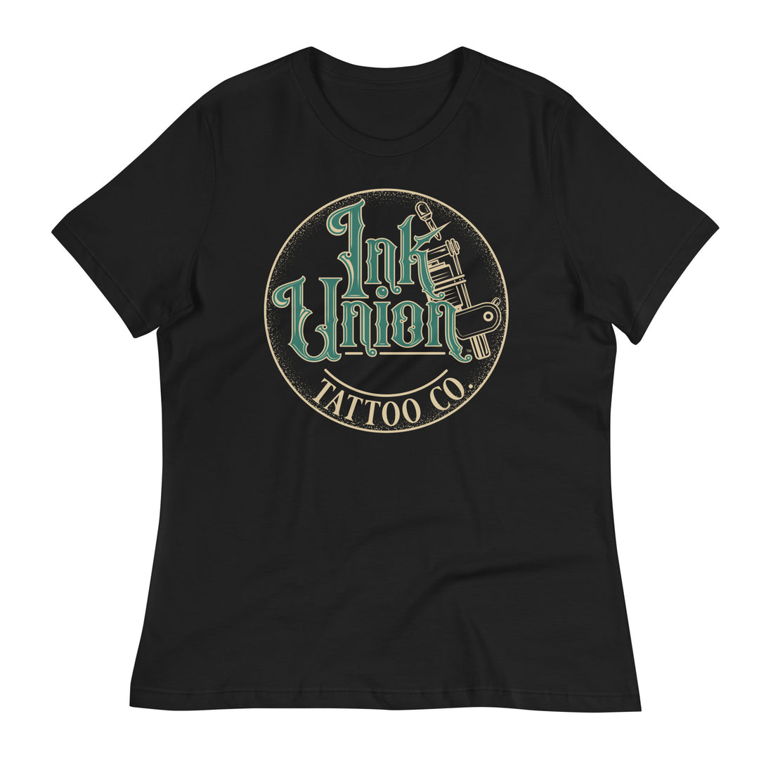 A black t-shirt with a gold circle containing fancy lettering in green and gold that says Ink Union and a gold tattoo machine peeking out from behind on the right side.  There is a dot work gradient inside the circle, and the words Tattoo Co. in gold are at the bottom of the design.