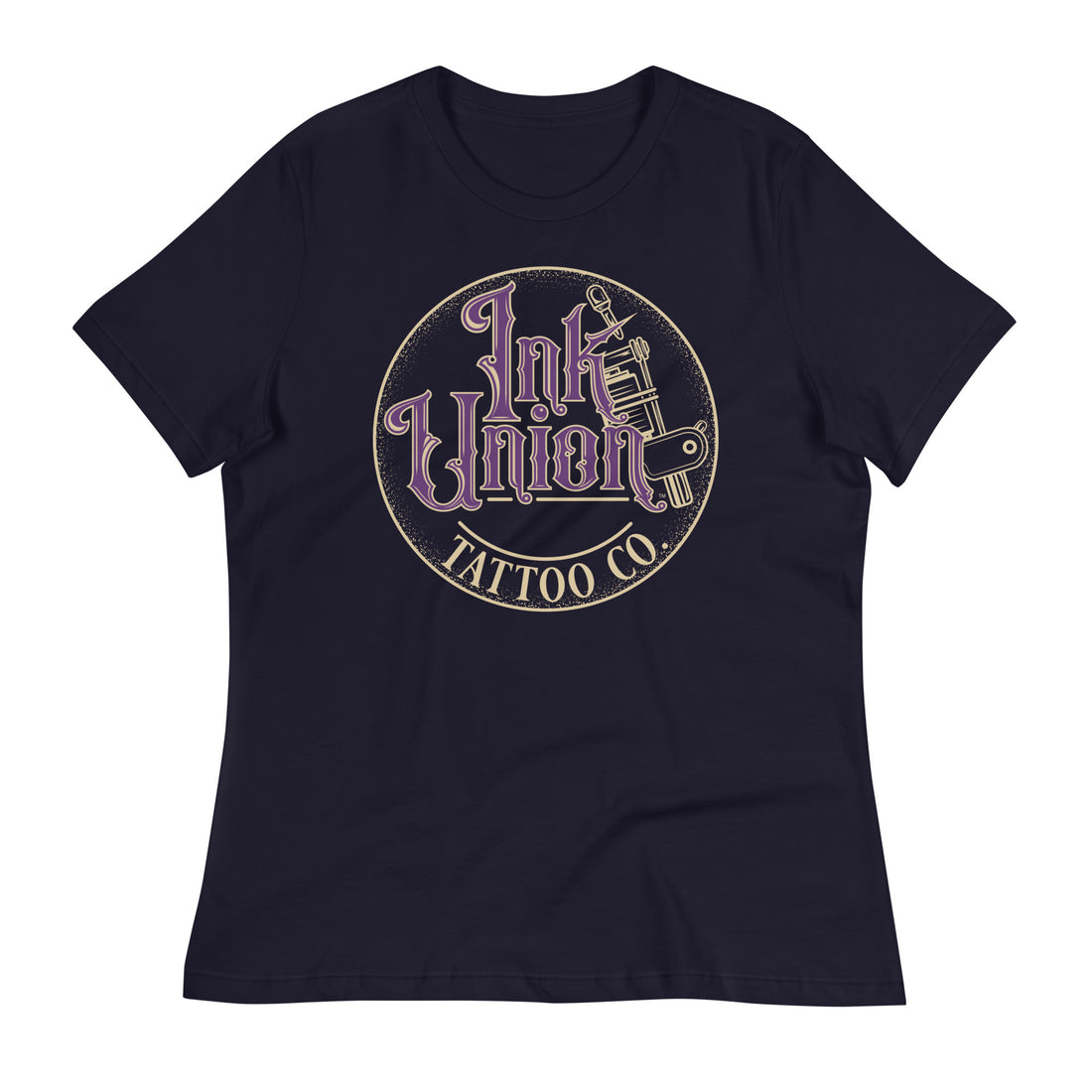 A navy blue t-shirt with a gold circle containing fancy lettering in purple and gold that says Ink Union and a gold tattoo machine peeking out from behind on the right side.  There is a dot work gradient inside the circle, and the words Tattoo Co. in gold are at the bottom of the design.