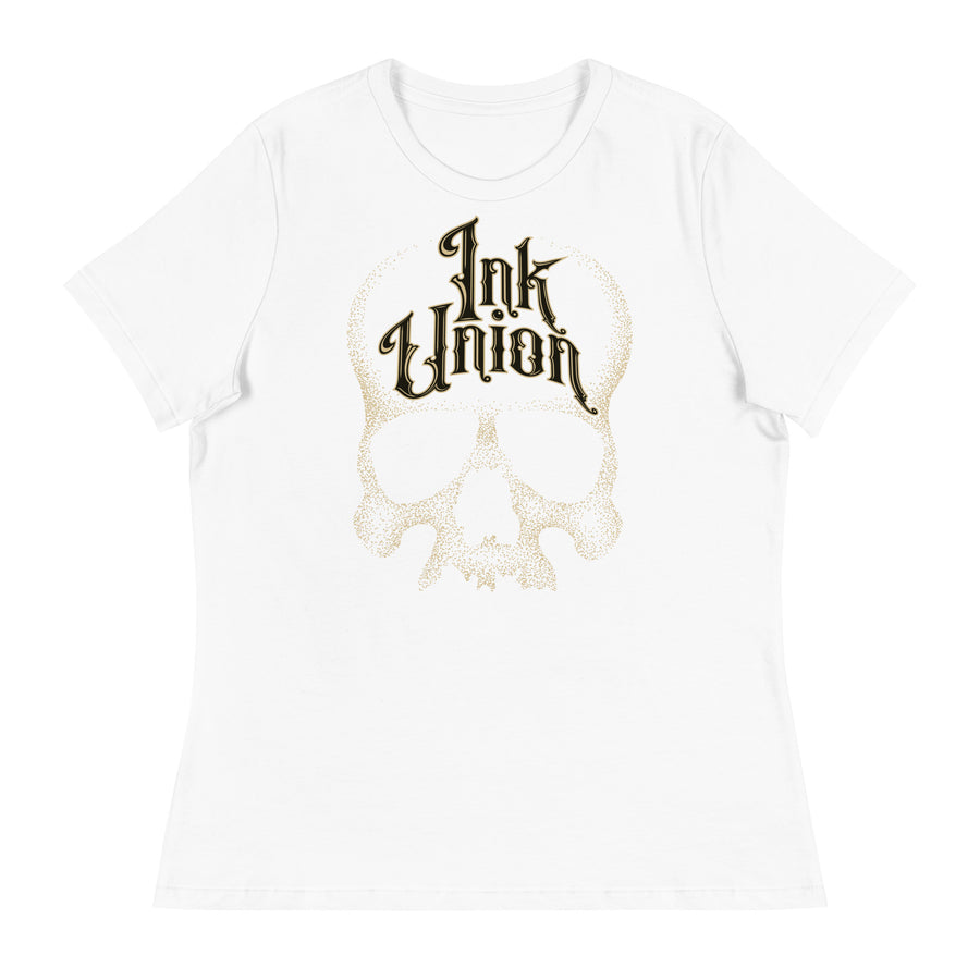 A white t-shirt adorned with a gold dot work human skull  and the words Ink Union in fancy gold and black lettering across the forehead of the skull.