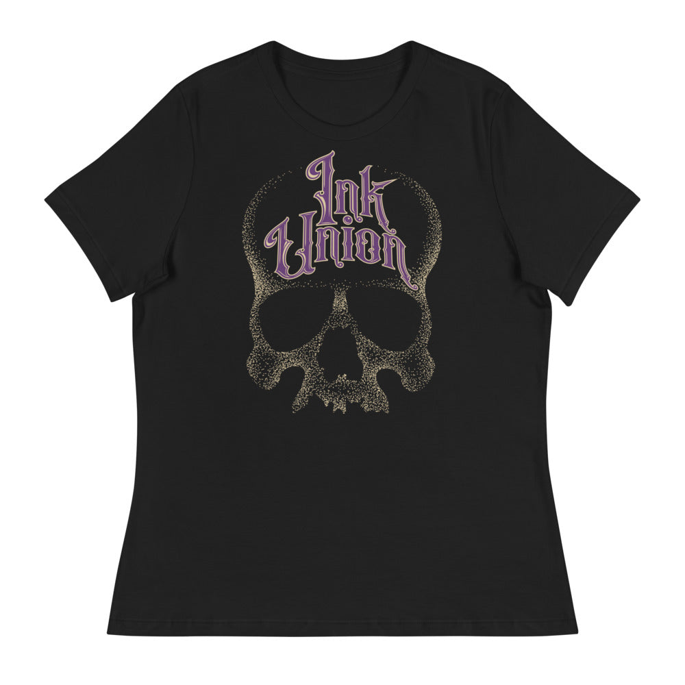 Ink Union Clothing Co. women's relaxed fit black t-shirt  featuring a large dot work gold skull centered on the shirt and Ink Union in large fancy gold and purple script across the forehead of the skull
