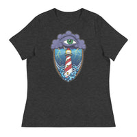 A dark grey t-shirt with an old school eye of the storm tattoo design of large dark purple storm clouds at the top of the design with a green eye in the middle of the clouds.  Below the clouds is an oval shape with brown rope. Inside the rope are stormy seas and lightning striking at a lighthouse that is white and red striped like a barber pole.